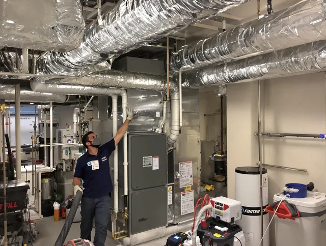 Wareham Air Duct Cleaning specialist performing thorough furnace duct cleaning in a Wareham residence